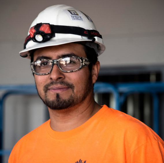 worker in orange shirt and hardhat
